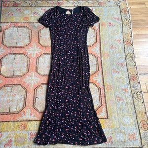 Free People black dress with pink, purple and orange flowers. Size medium.